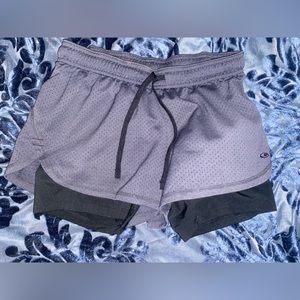 Athletic shorts with attached compressions